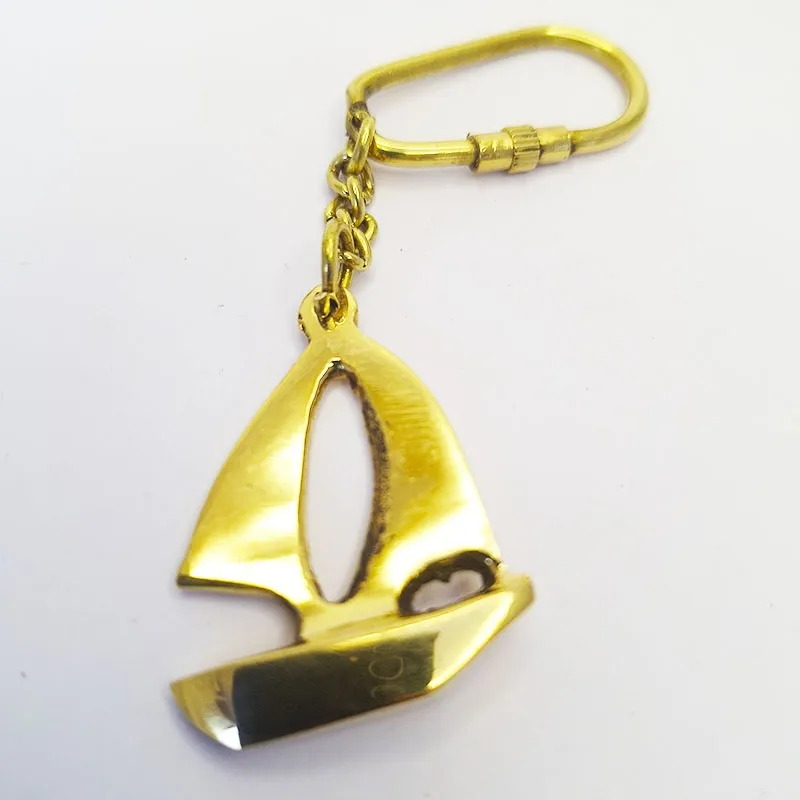 Bronze key ring with a bronze yacht, sailboat