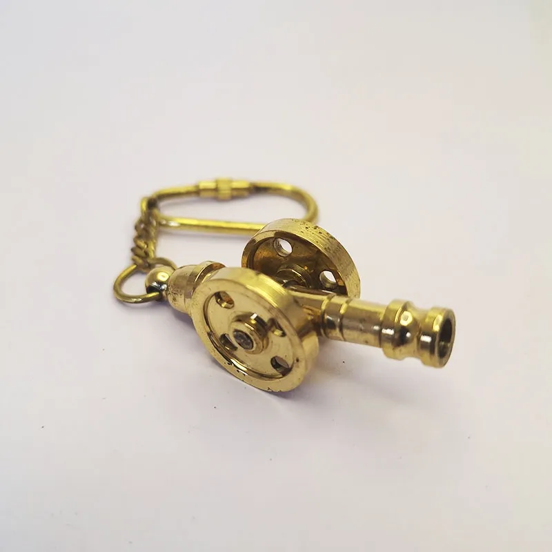 Bronze key chain with bronze cannon, cannon