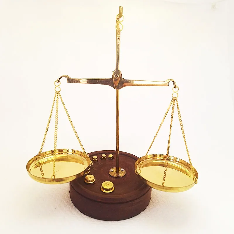 Bronze scale with wooden base