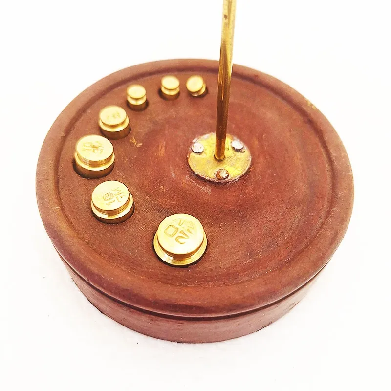 Bronze scale with wooden base