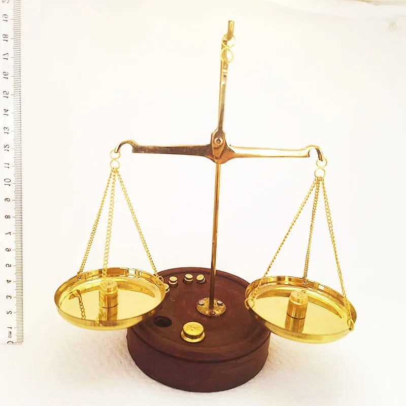 Bronze scale with wooden base